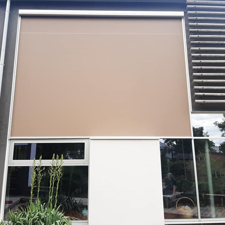 cream beige soft sand color roller blinds on facade modern building custom made